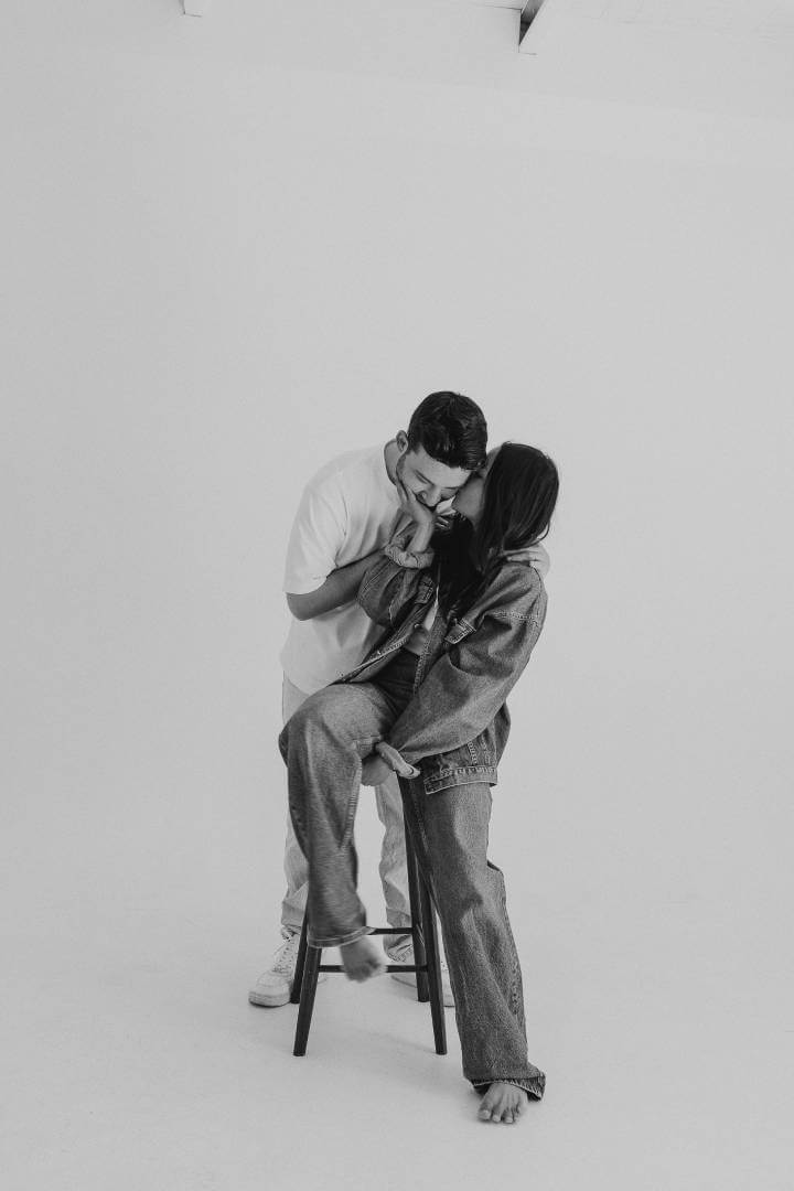 Photo of a couple hugging in a studio